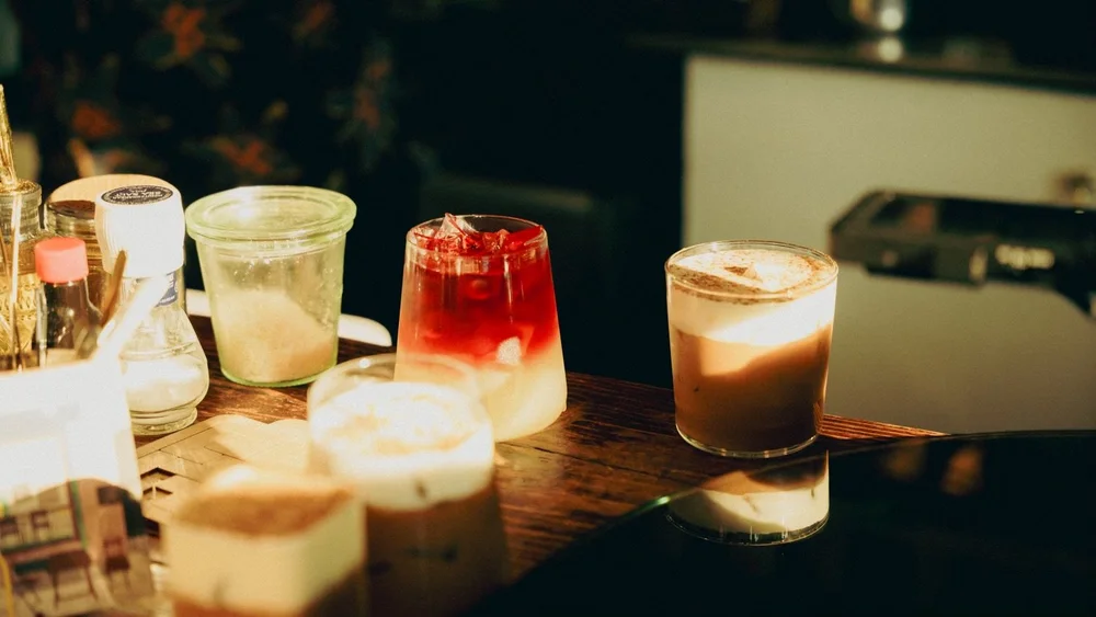 Photo of Larry's beverages on a wooden table.