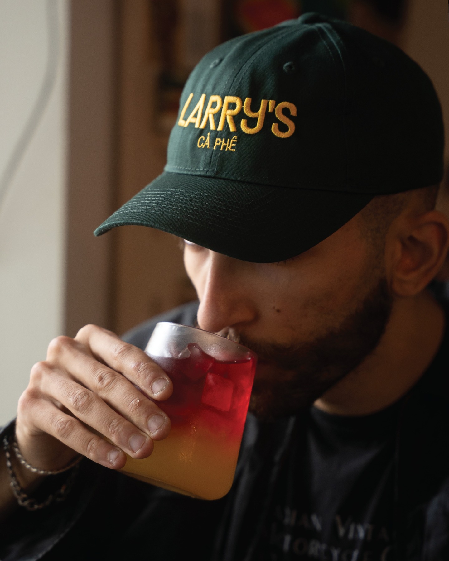 Larrys merch green & yellow hat front photo